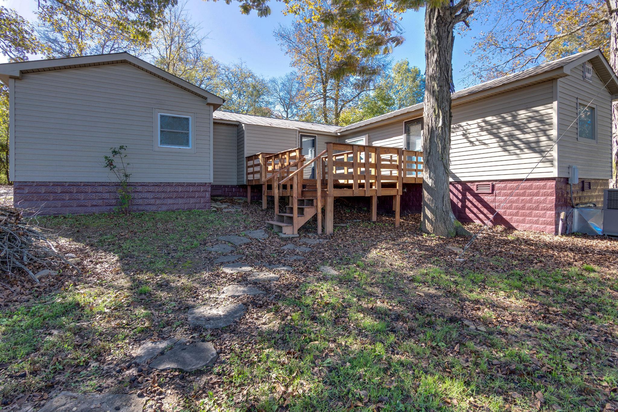 5029 Will Brown Road Spring Hill, TN 37174 - Photo 18 of 24 a view of a house with backyard and chairs