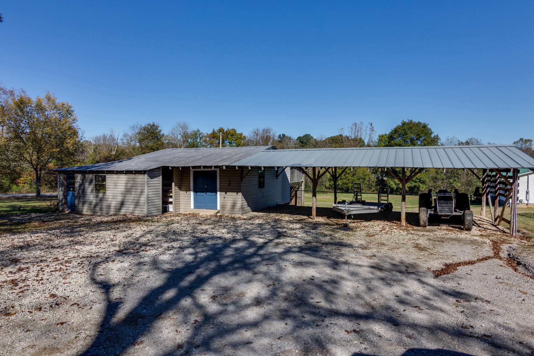 5029 Will Brown Road Spring Hill, TN 37174 - Photo 20 of 24 a view of a house with backyard and sitting area