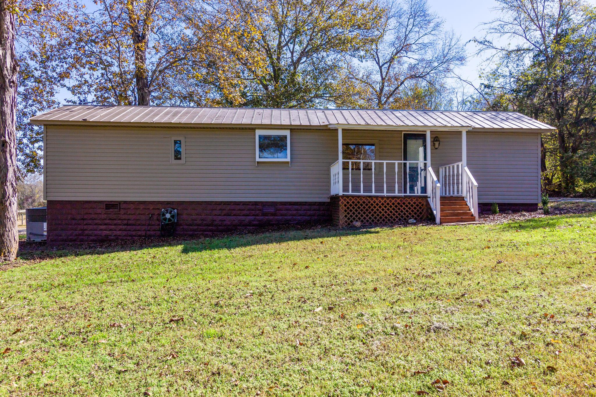 5029 Will Brown Road Spring Hill, TN 37174 - Photo 2 of 24 a front view of a house with a yard