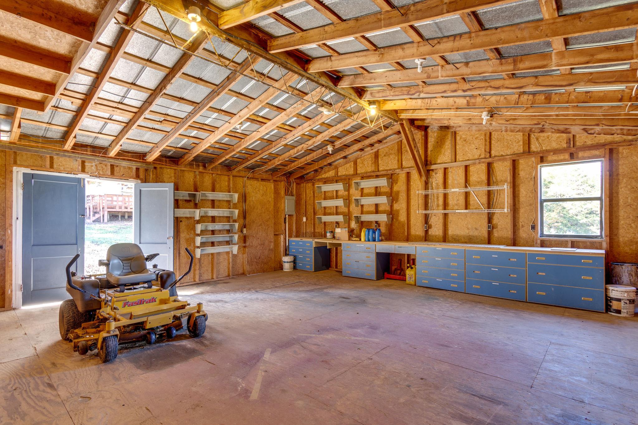5029 Will Brown Road Spring Hill, TN 37174 - Photo 21 of 24 a living room with furniture gym equipment and a large window