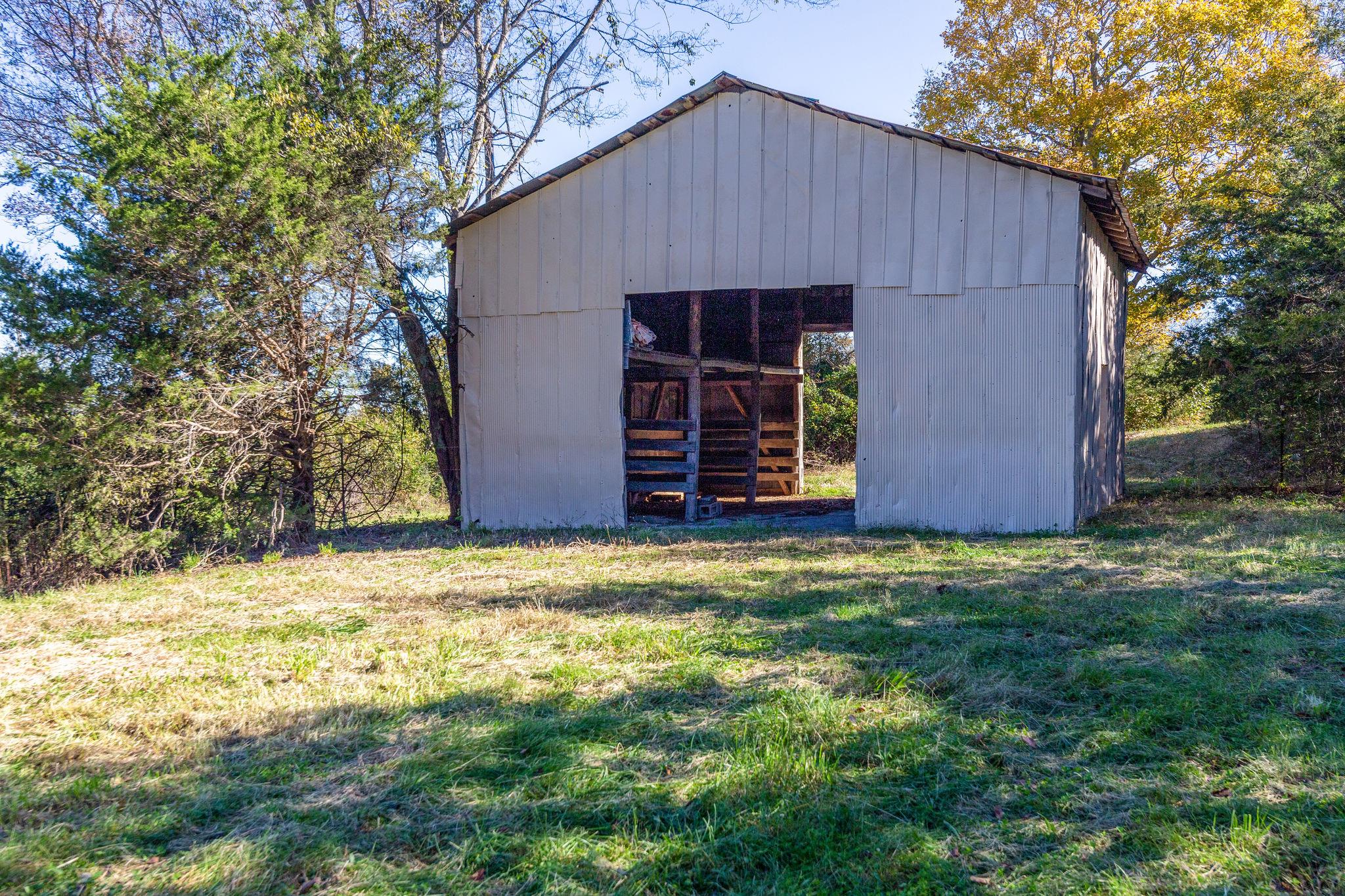 5029 Will Brown Road Spring Hill, TN 37174 - Photo 23 of 24 a house with green field in front of it