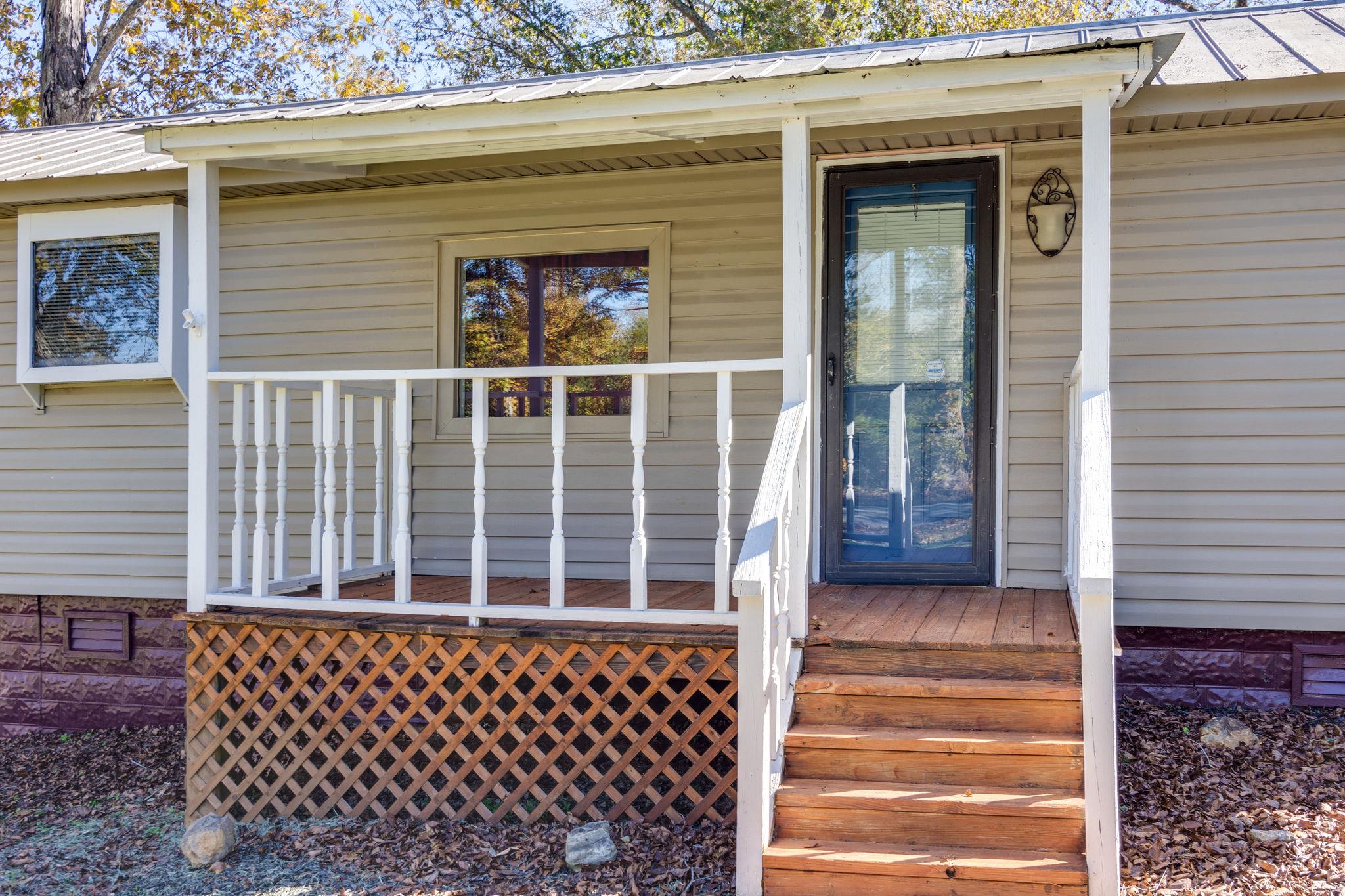 5029 Will Brown Road Spring Hill, TN 37174 - Photo 3 of 24 a side view of a house with a large window