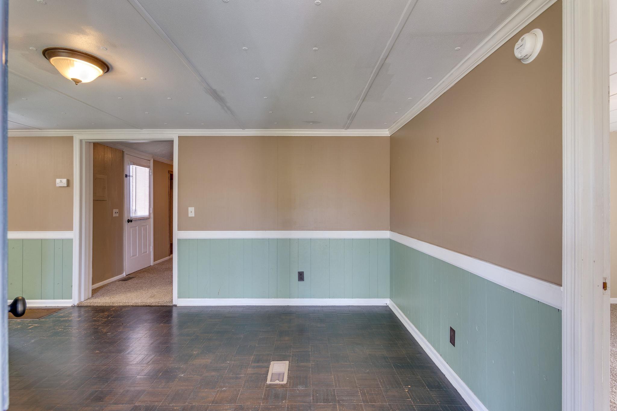 5029 Will Brown Road Spring Hill, TN 37174 - Photo 4 of 24 a view of an empty room with wooden floor and windows