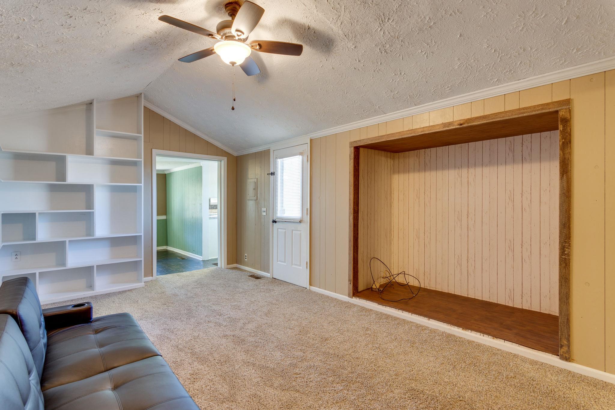 5029 Will Brown Road Spring Hill, TN 37174 - Photo 9 of 24 a bedroom with a bed and a chandelier fan