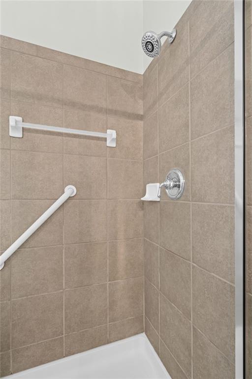 4945 Kings Common Way Cumming, GA 30040 - Photo 24 of 40 a bathroom with a shower