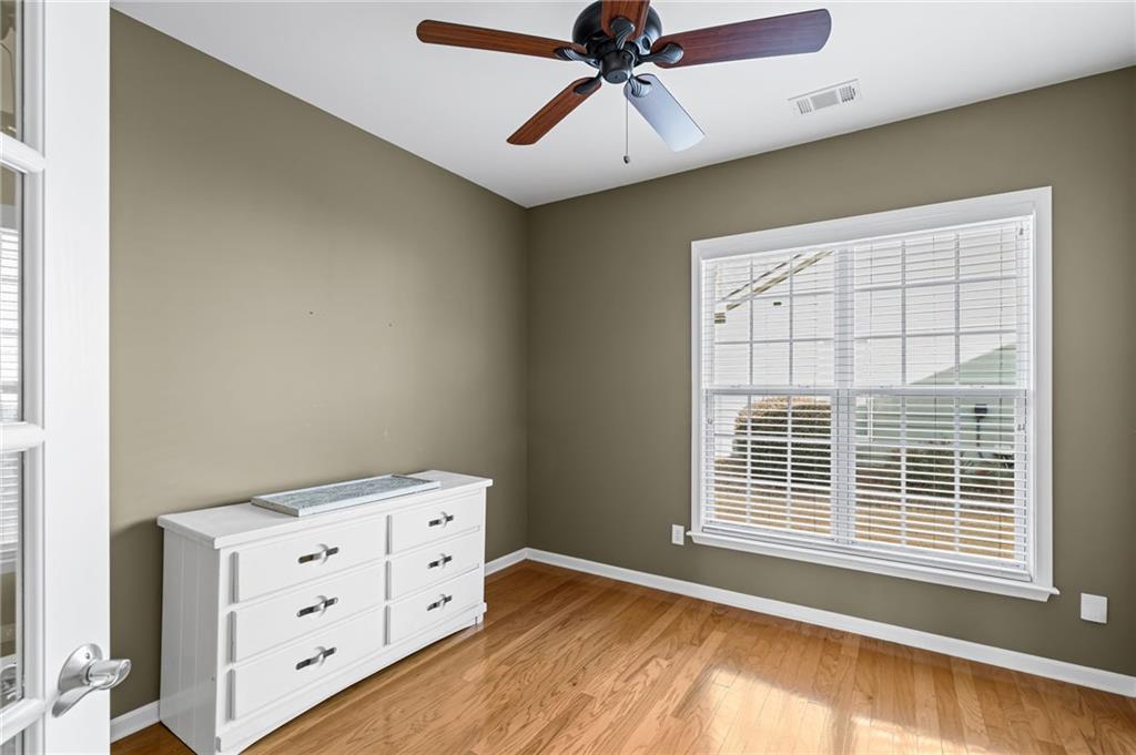 4945 Kings Common Way Cumming, GA 30040 - Photo 25 of 40 a view of an empty room with a window