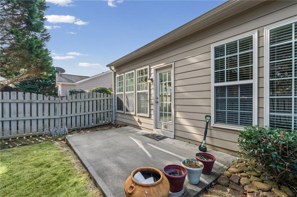 4945 Kings Common Way Cumming, GA 30040 - Photo 30 of 40 a front view of a house with a garden
