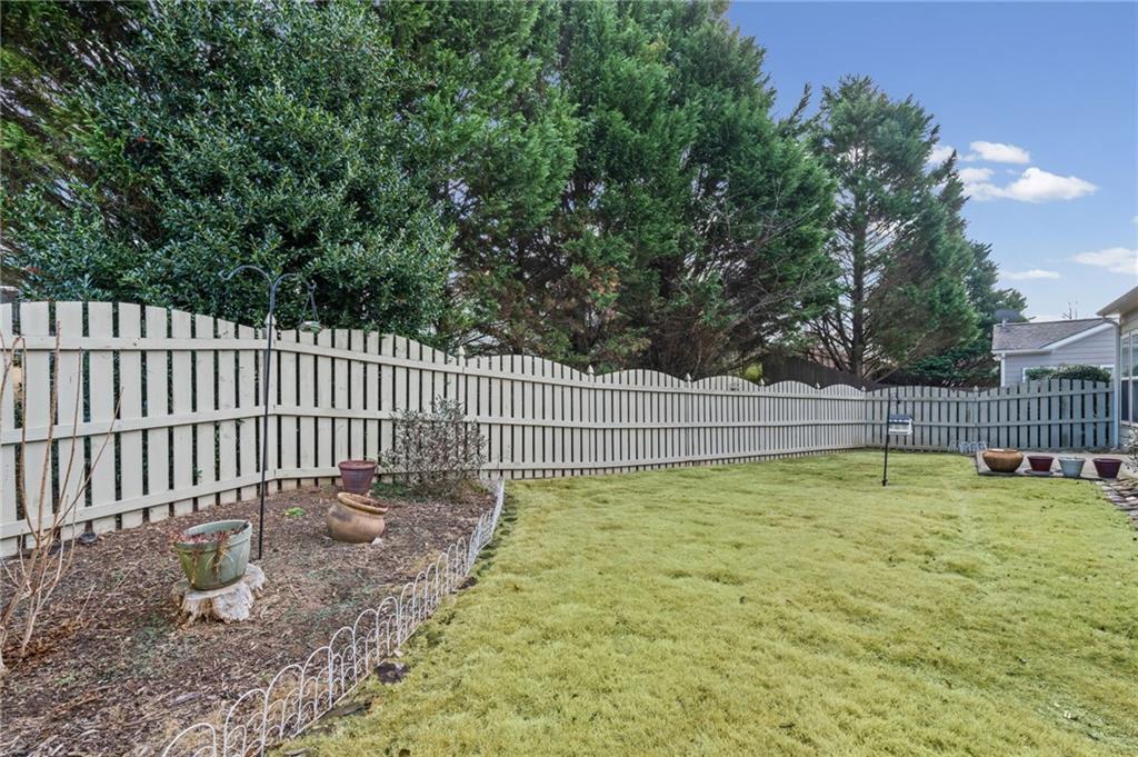 4945 Kings Common Way Cumming, GA 30040 - Photo 31 of 40 a garden view
