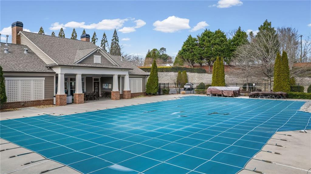 4945 Kings Common Way Cumming, GA 30040 - Photo 34 of 40 a view of a house with a patio
