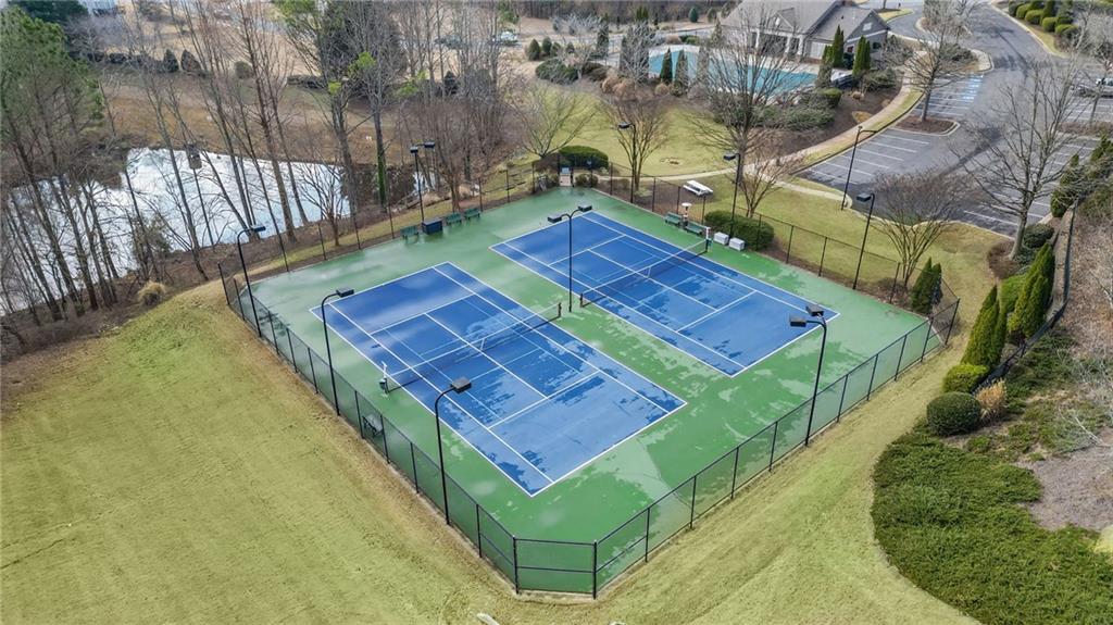 4945 Kings Common Way Cumming, GA 30040 - Photo 36 of 40 a view of a backyard with a water fountain