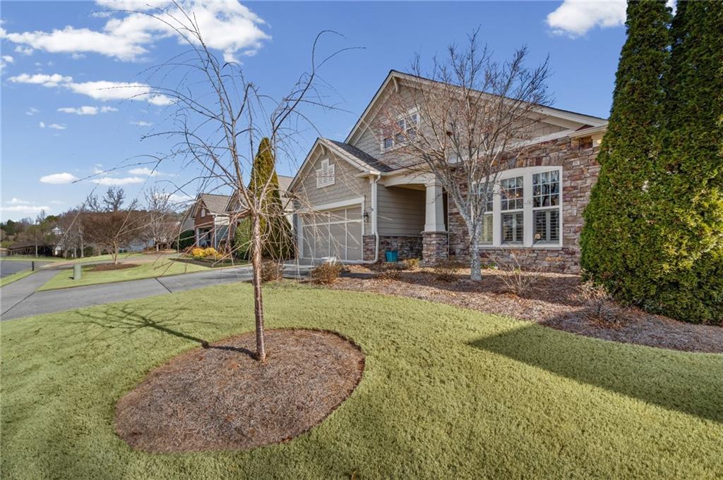 4945 Kings Common Way Cumming, GA 30040 - Photo 4 of 40 a view of a house with entertaining space