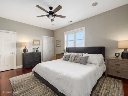 a bedroom with a bed and flat screen tv