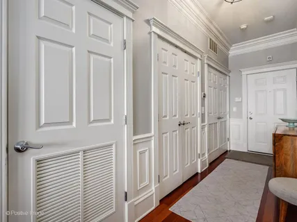 a view of a hallway with a wooden door