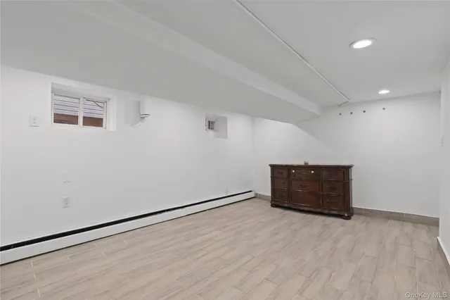 an empty room with wooden floor