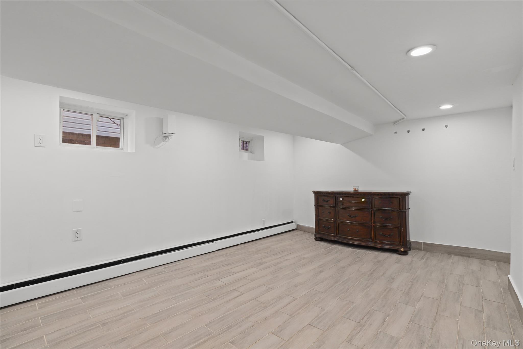 1631 Paulding Avenue Bronx, NY 10462 - Photo 11 of 22 an empty room with wooden floor