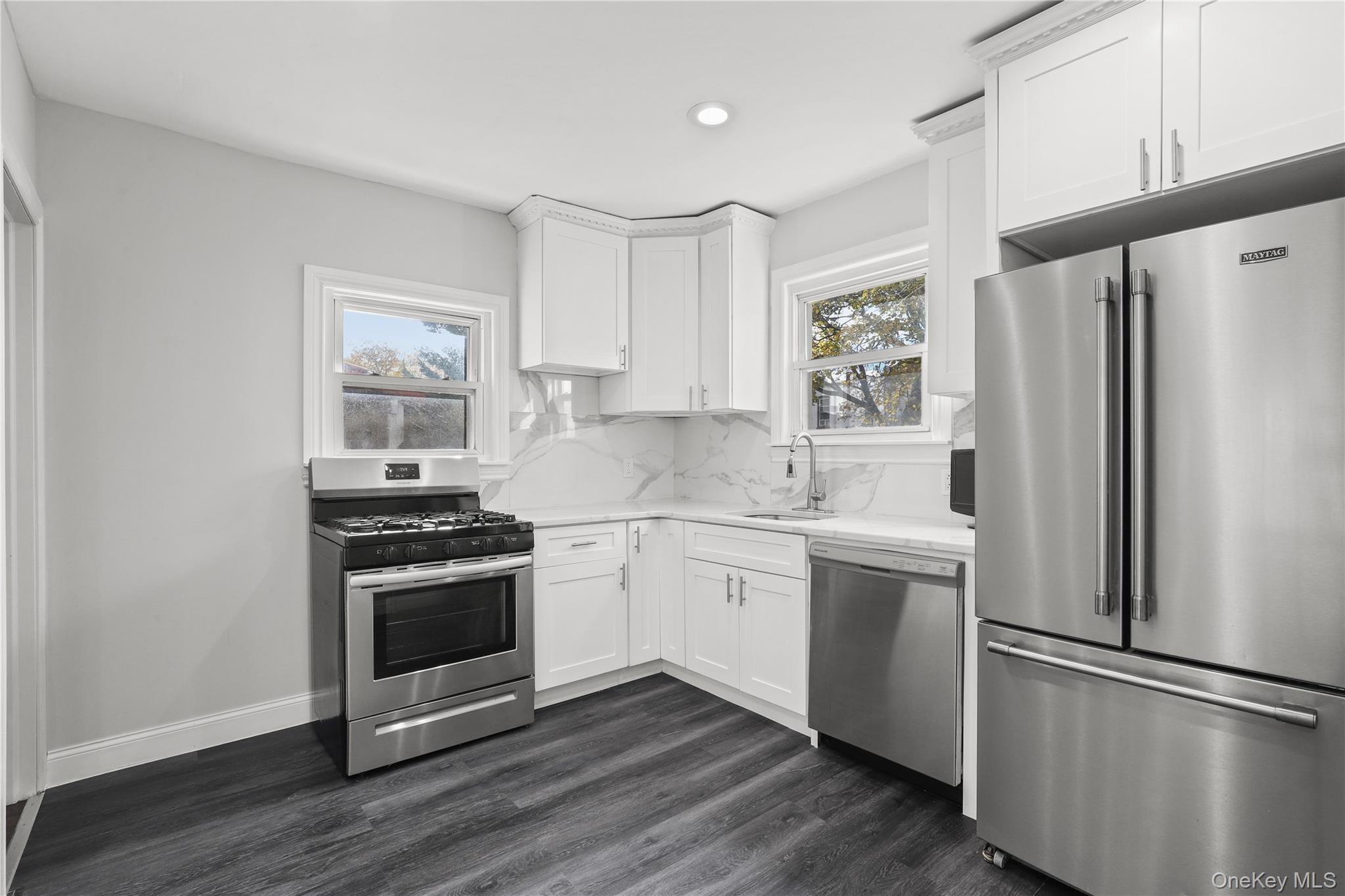 1631 Paulding Avenue Bronx, NY 10462 - Photo 7 of 22 a kitchen with a refrigerator stove and sink