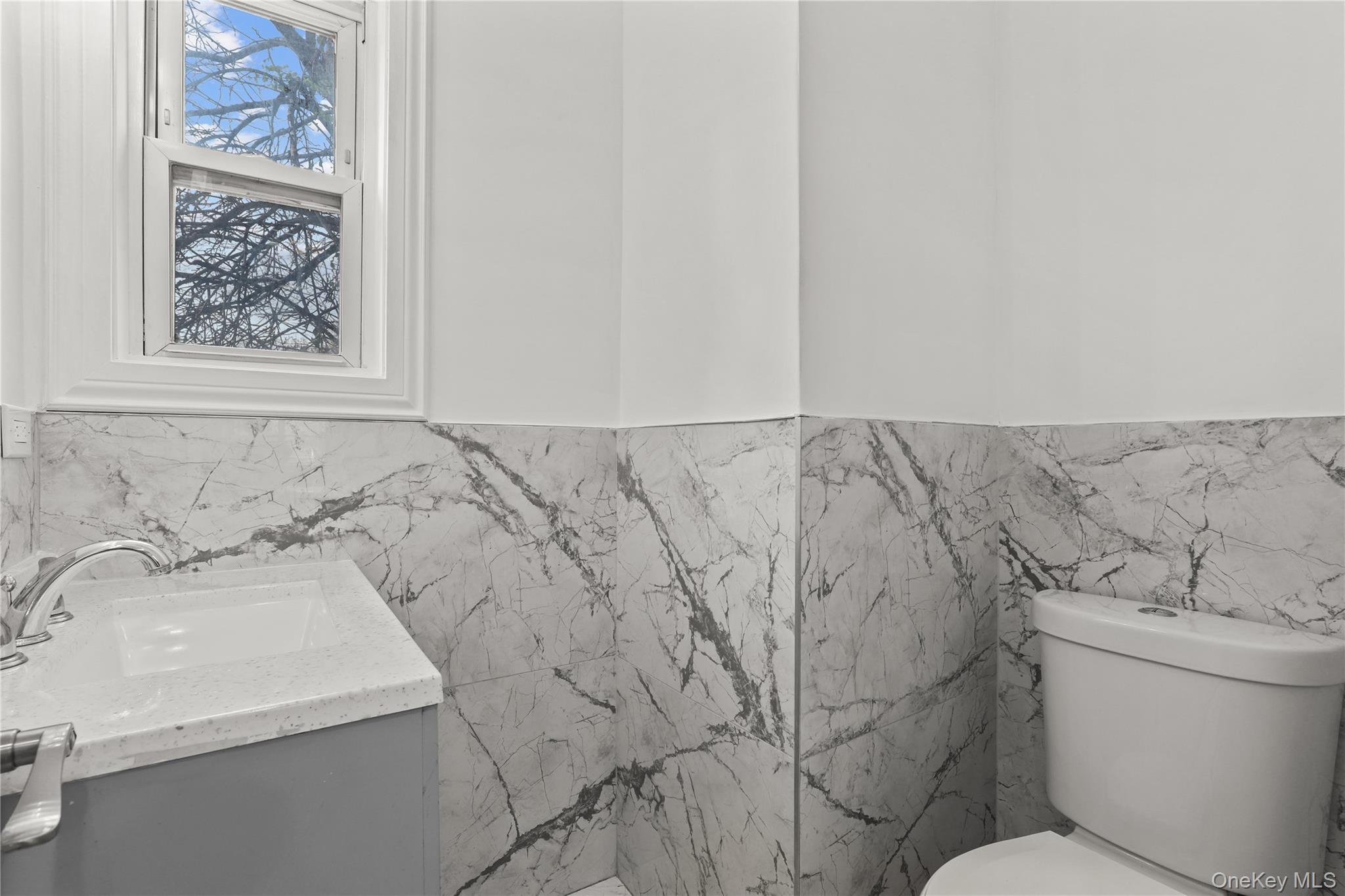 1631 Paulding Avenue Bronx, NY 10462 - Photo 8 of 22 a bathroom with a sink and a toilet