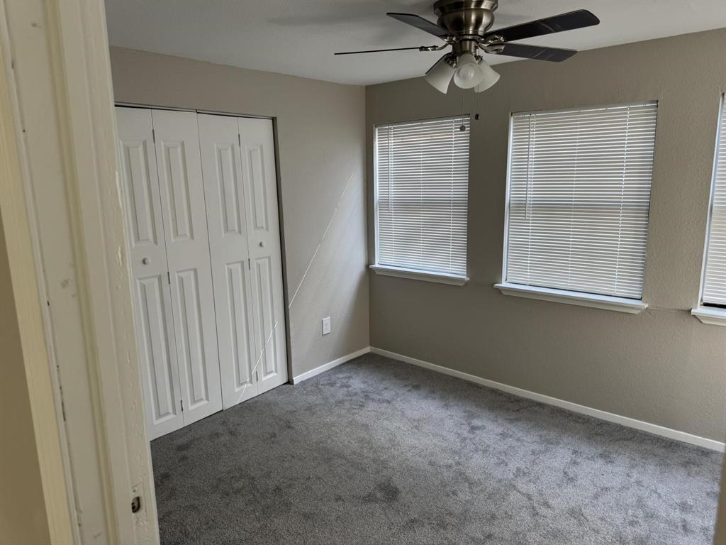 8427 Ridgelea Street Dallas, TX 75209 - Photo 13 of 17 a view of an empty room with a window