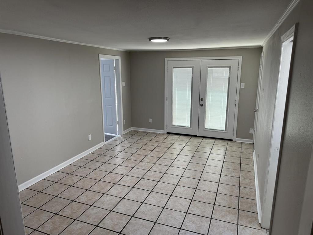 8427 Ridgelea Street Dallas, TX 75209 - Photo 15 of 17 a view of an empty room and window