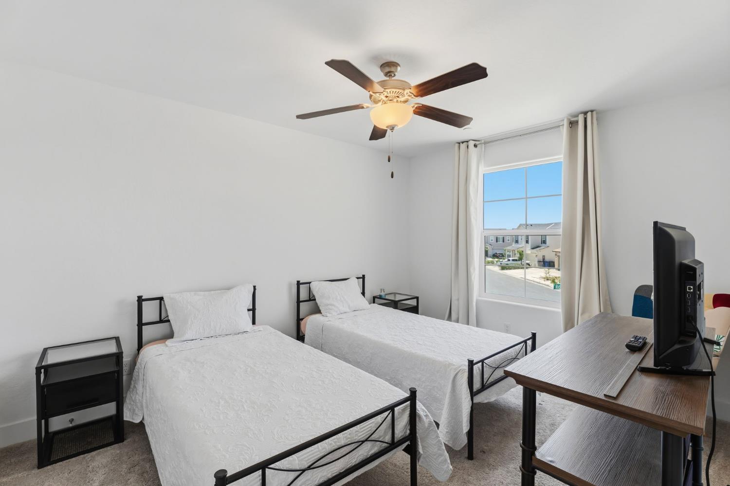 6326 West Richert Avenue Fresno, CA 93723 - Photo 30 of 45 a bedroom with a bed and a flat screen tv