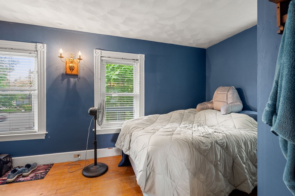 26 Powder Mill Road Maynard, MA 01754 - Photo 8 of 16 a bedroom with a bed and a window