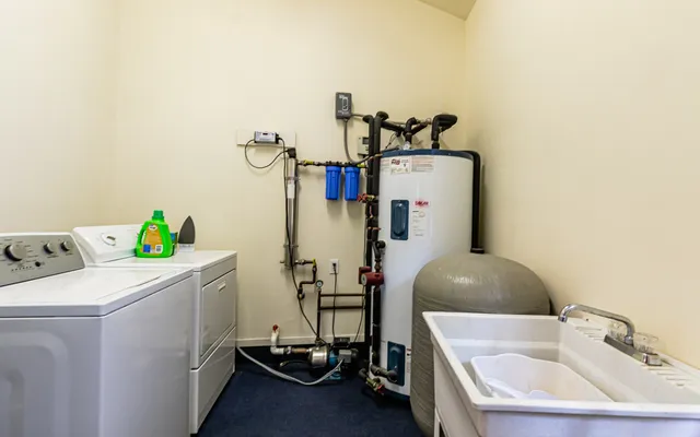 a bathroom with a sink and a washing machine