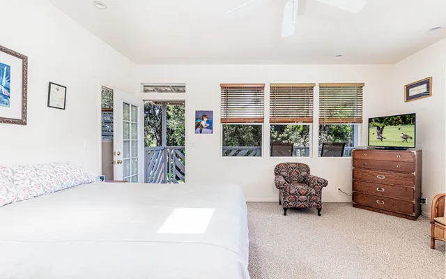 a balcony with wooden floor and outdoor space