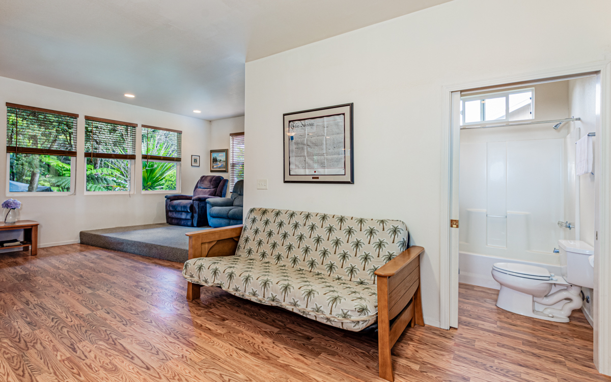 99-1846 Painiu Loop Volcano, HI 96785 - Photo 9 of 30 a living room with furniture and a large window