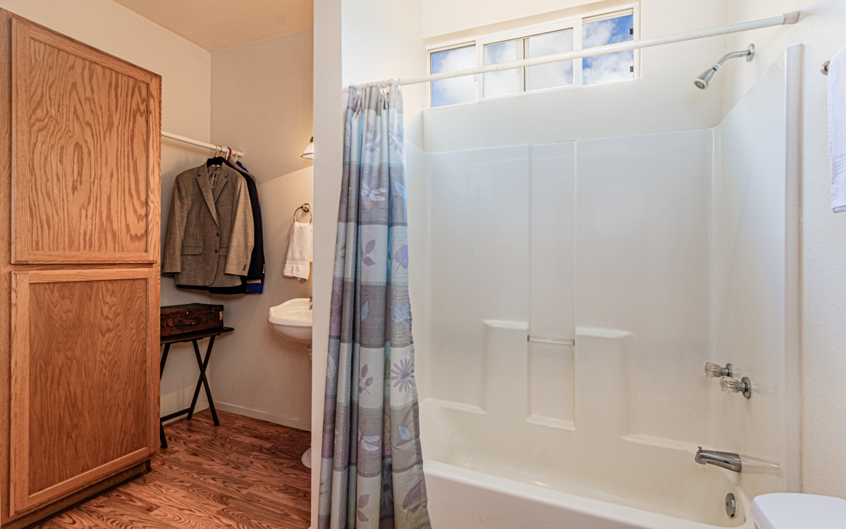 99-1846 Painiu Loop Volcano, HI 96785 - Photo 10 of 30 a bathroom with a shower