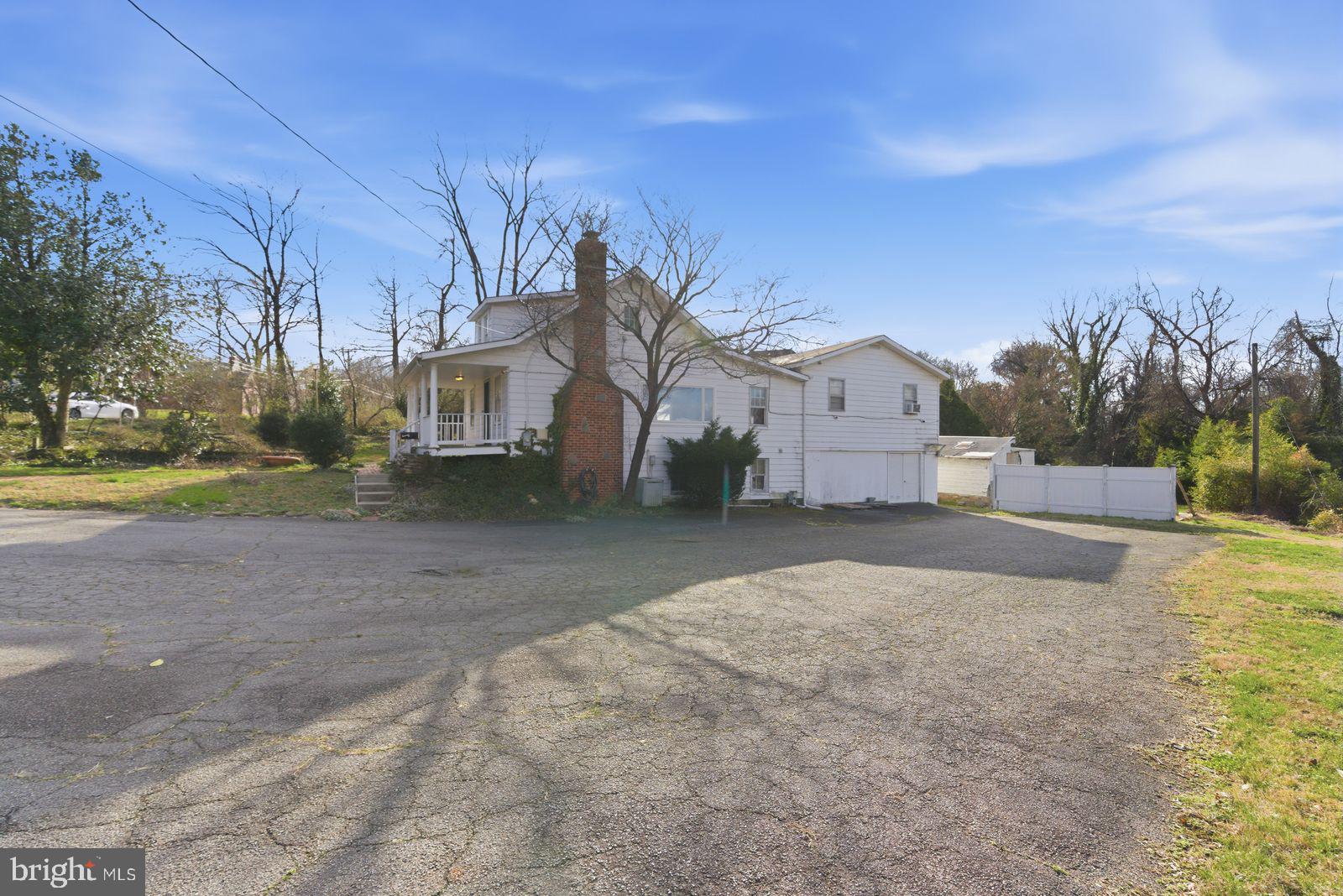 4464 North Old Glebe Road Arlington, VA 22207 - Photo 12 of 21 a view of large house with a yard and a large tree