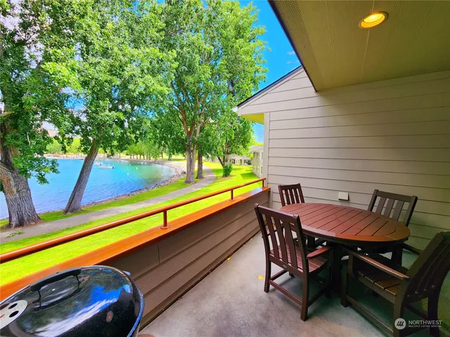 a view of a two chairs in the balcony