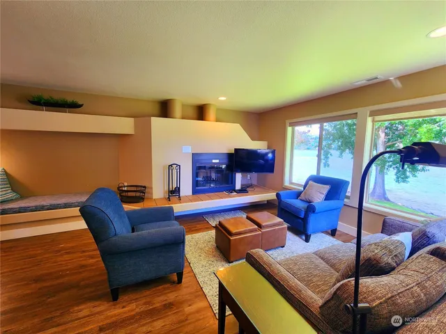 a living room with furniture and a large window