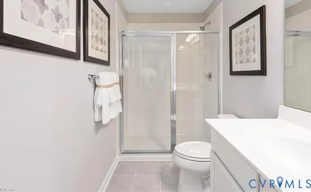 a bedroom with a bed and a night stand