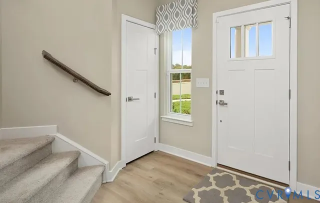 a view of livingroom with hallway and stairs