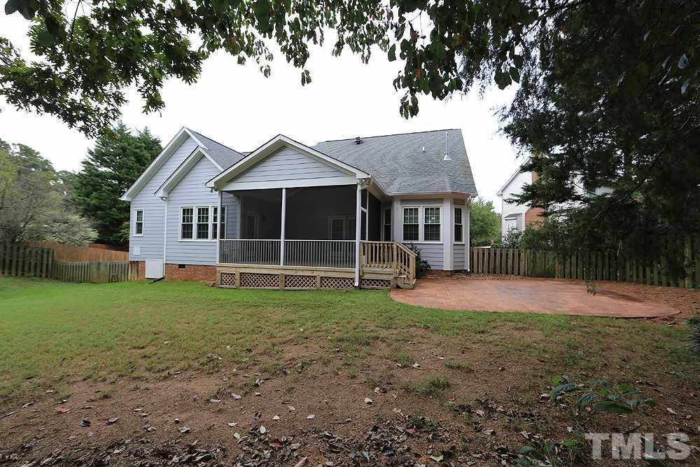 8203 Kitzel Way Raleigh, NC 27615 - Photo 13 of 14 a view of a house with a yard and large tree