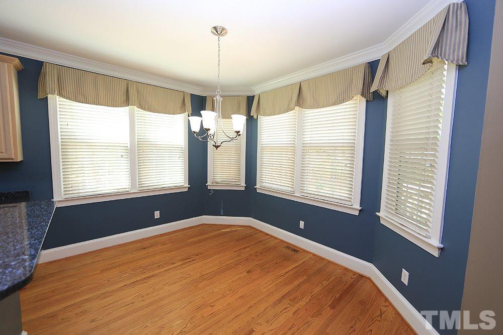 8203 Kitzel Way Raleigh, NC 27615 - Photo 5 of 14 a bedroom with a bed and a window