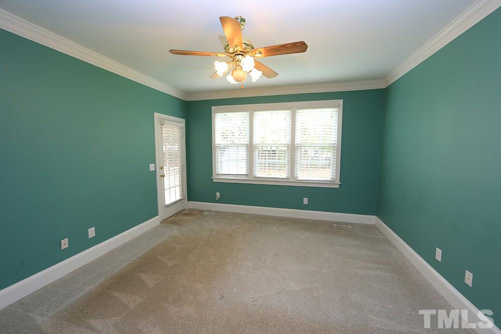 8203 Kitzel Way Raleigh, NC 27615 - Photo 7 of 14 an empty room that has a window