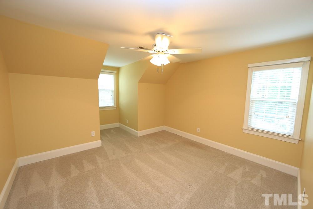 8203 Kitzel Way Raleigh, NC 27615 - Photo 9 of 14 a view of an empty room with a window