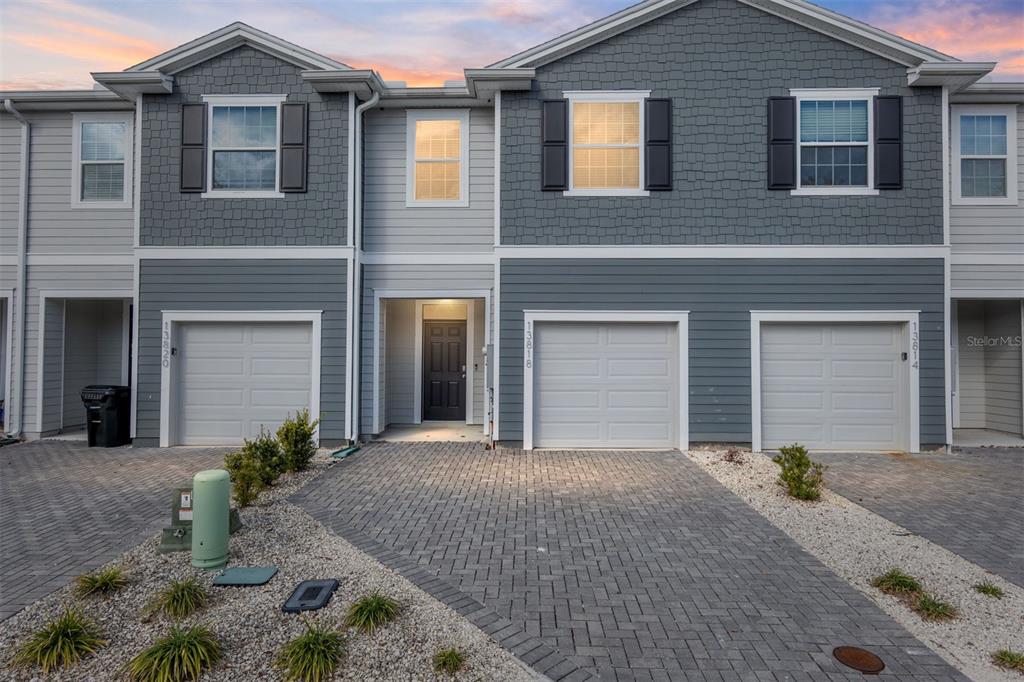a front view of a house with garage