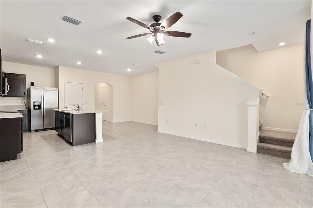 13818 Northwest 9th Road Newberry, FL 32669 - Photo 13 of 56 a view of a kitchen with a sink and a refrigerator