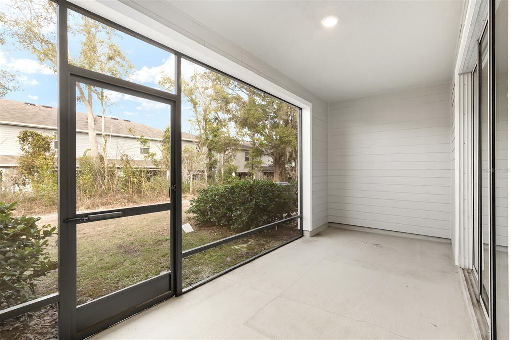 13818 Northwest 9th Road Newberry, FL 32669 - Photo 15 of 56 an empty room with wooden floor and windows