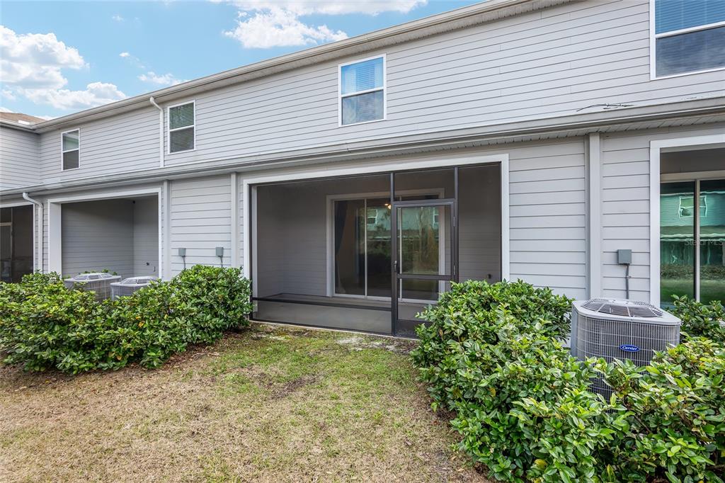 13818 Northwest 9th Road Newberry, FL 32669 - Photo 16 of 56 a front view of a house with garden