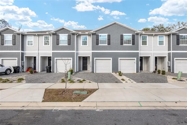 a kitchen with sink cabinets and microwave