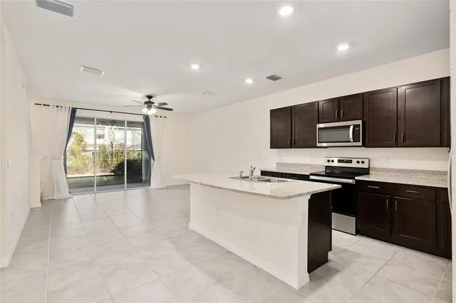 an empty room with windows and outdoor view