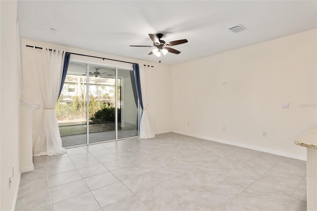 13818 Northwest 9th Road Newberry, FL 32669 - Photo 34 of 56 wooden floor in an empty room with a window
