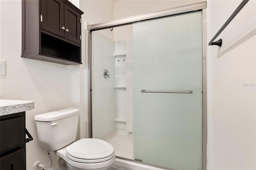 13818 Northwest 9th Road Newberry, FL 32669 - Photo 38 of 56 a white toilet sitting next to a bathroom sink