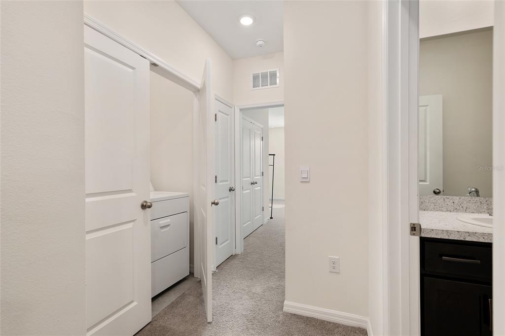13818 Northwest 9th Road Newberry, FL 32669 - Photo 39 of 56 a bathroom with a double vanity sink and mirror