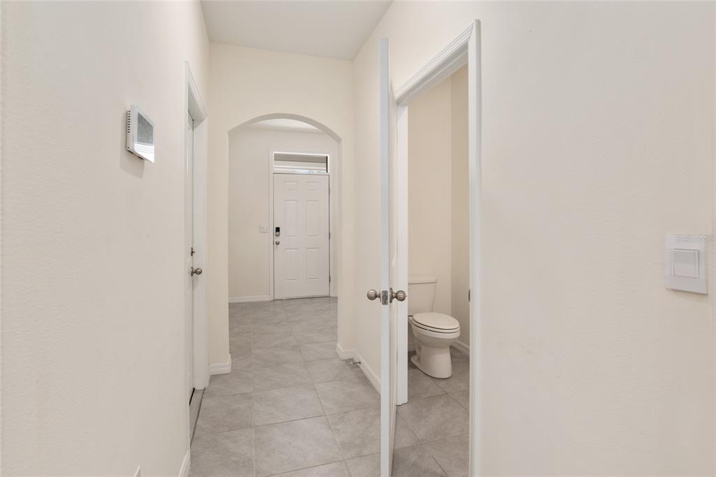 13818 Northwest 9th Road Newberry, FL 32669 - Photo 5 of 56 a bathroom with a granite countertop shower