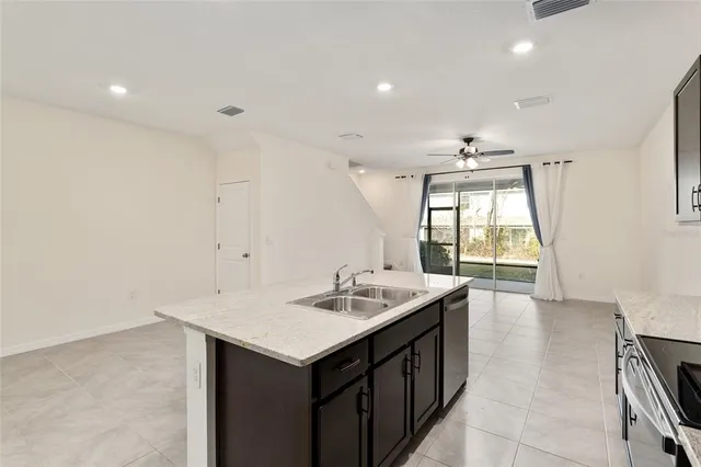 a kitchen with a sink and refrigerator