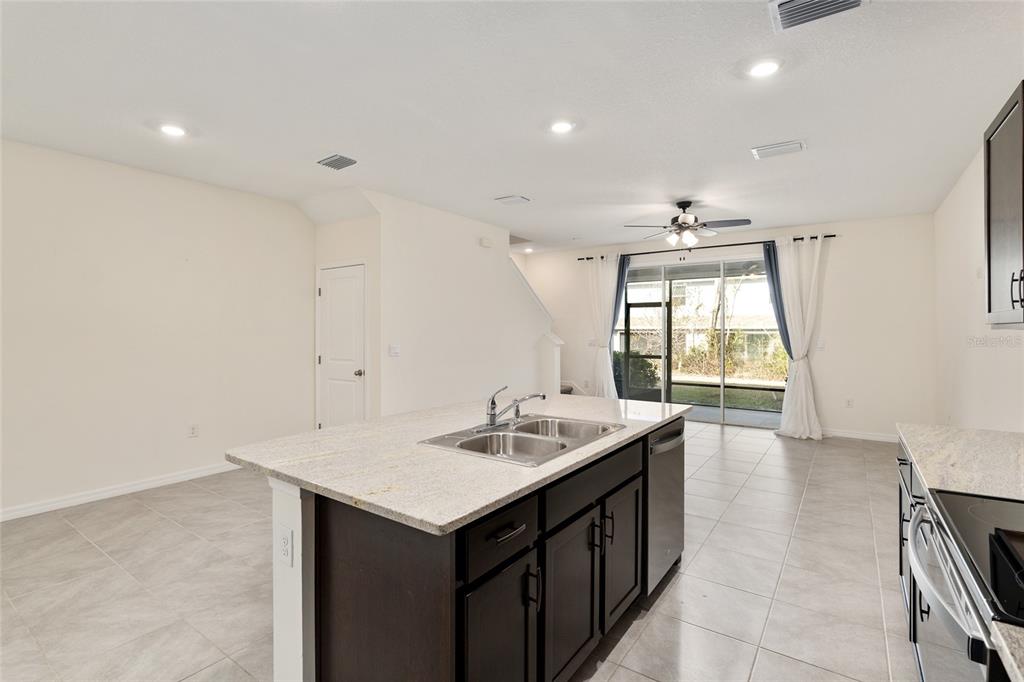 13818 Northwest 9th Road Newberry, FL 32669 - Photo 7 of 56 a kitchen with a sink cabinets and window